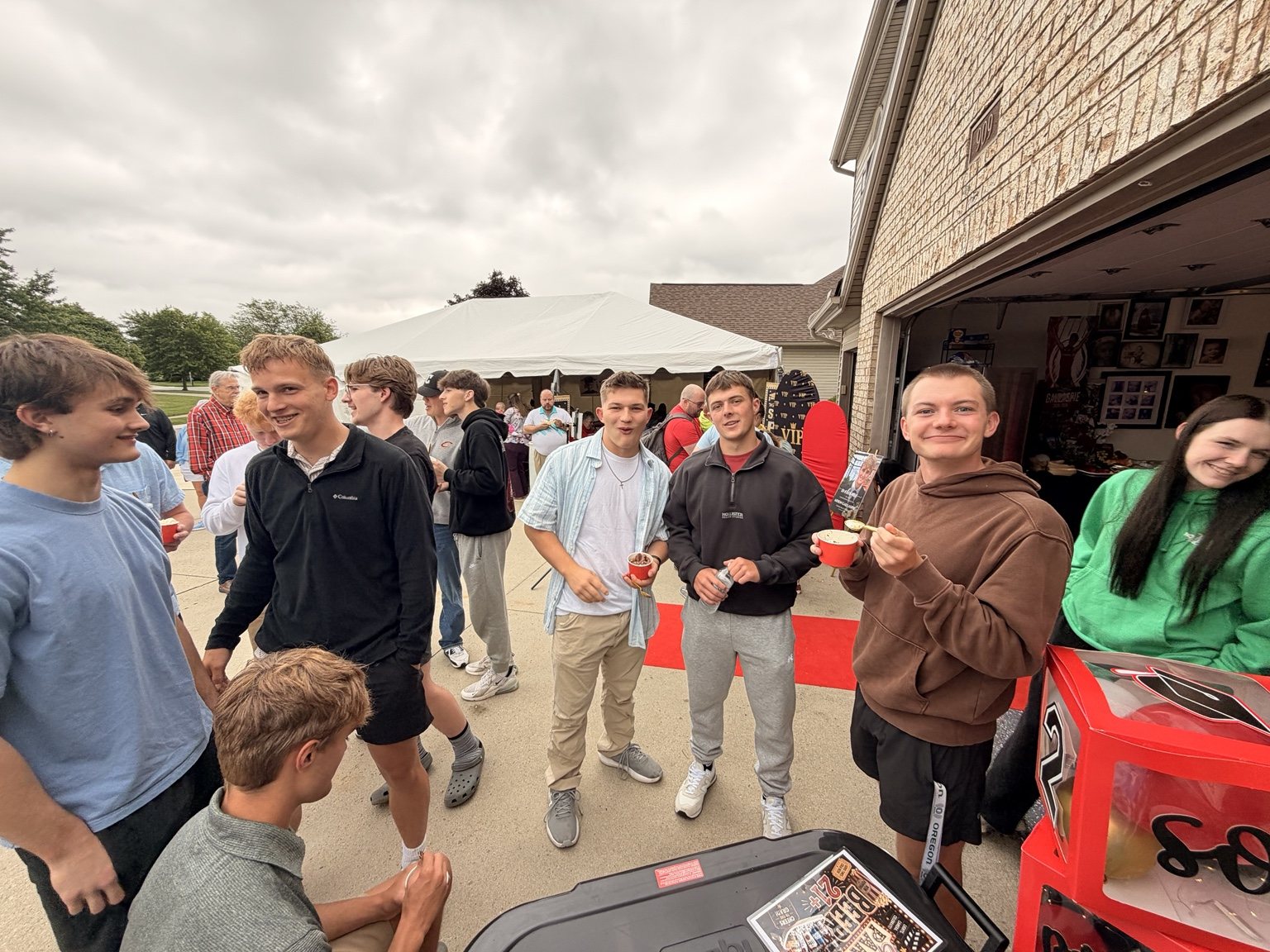 Graduation party guests enjoying ice cream